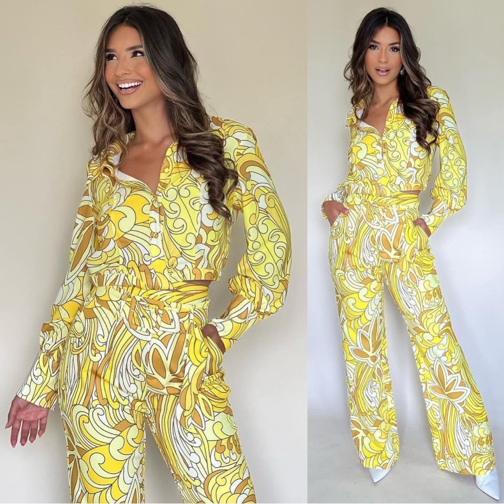 Yellow and white abstract print long-sleeve crop top and wide-leg pant set.